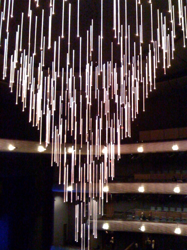 This was the first time I got to see the Winspear's retractable chandelier in full effect. Very cool. After the show, someone who was involved with its construction showed me pics on his iPhone of what the chandelier can REALLY do. Apparently this is top secret. But the thing can assume all sorts of shapes, and it can produce every color imaginable. 
