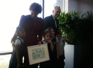 Linda and Mitch Hart with students from the Laureate Preparatory School