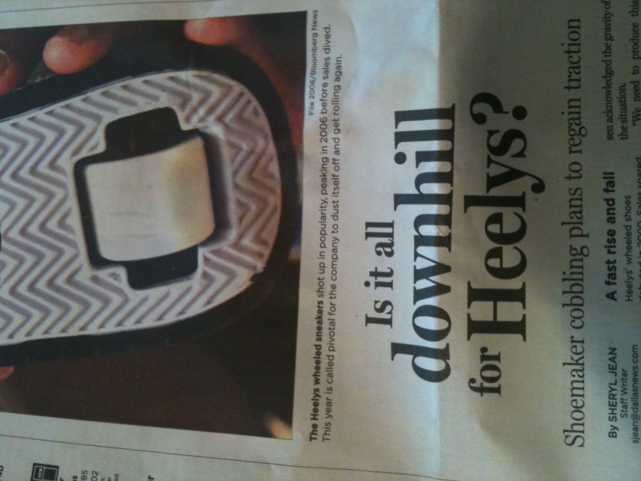 As you can see (probably) from this photo of today's business section, for this story about the sneakers-with-wheels company Heelys, they managed to squeeze a pun into the cutline for the photo, the headline, AND the subhead. That is impressive. And if you think I'm being snarky, you really don't have a clue what I do all day. 