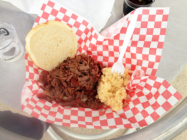 Holy Smoke's pulled pork sandwich and jalapeno cheese grits