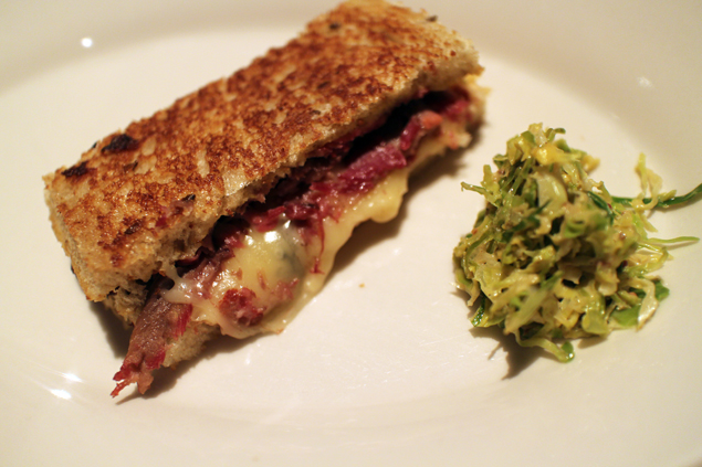 Pressed corned beef tongue sandwich, warm brussels sprout salad