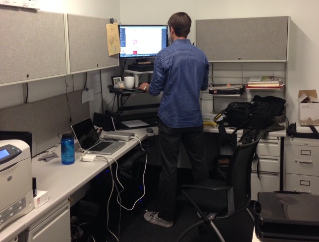 Matthew Shelley standing at his Varidesk, feeling strong and robust