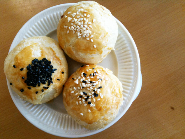 These flaky pastries are filled with soft red beans inside. (via Flickr)