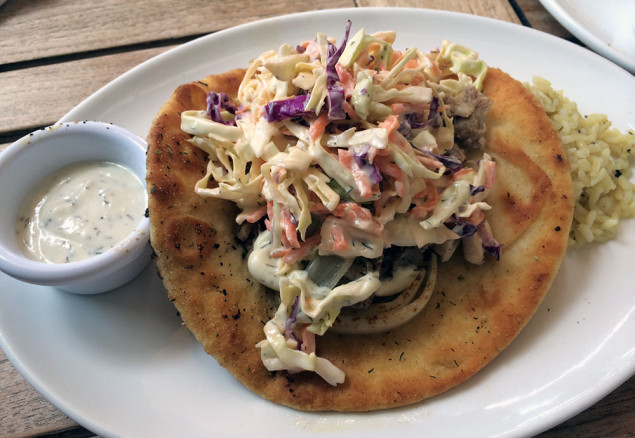 Kalua pork pita with imu steamed pork, sauteed Maui onion, dill scallionaise, and Mediterranean slaw