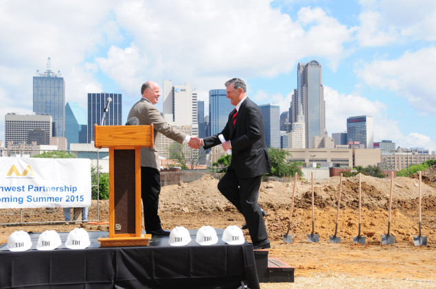 Developer Jack Matthews welcomes Dallas Mayor Mike Rawlings to the stage at the groundbreaking ceremony for 1210 South Lamar.