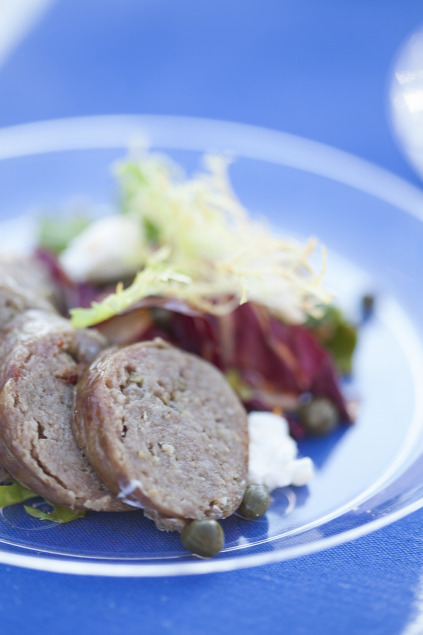 Turkey fennel sausage with chicory salad and smoked tomato vin. Photo by Kim Duffy.