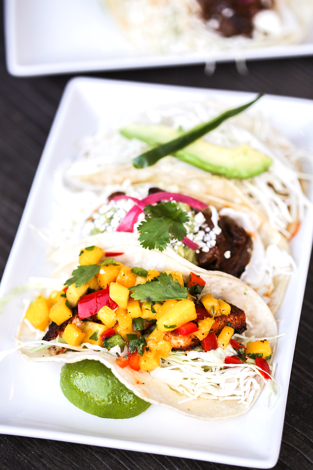 The "Taco Bar!" section of the menu includes chicken, beef cheek, seasonal Pacific white fish tacos.