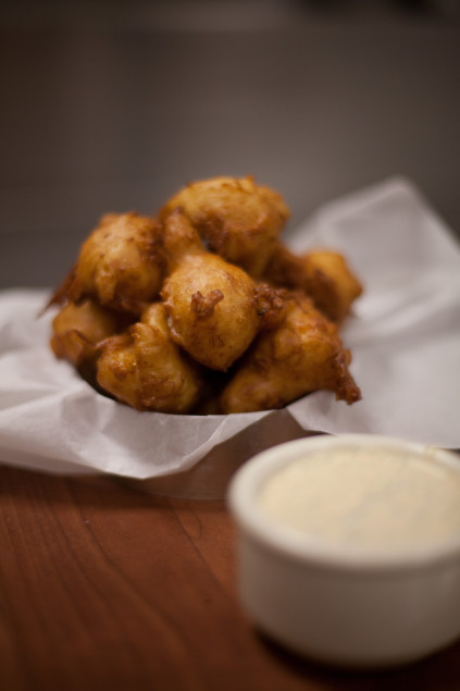 Blue crab beignets with remoulade. Photography by Kim Duffy.