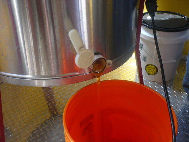 The extractor uses centrifugal force to extract honey from the comb.