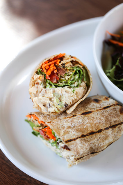 The Unleavened: Chicken salad, currants, golden raisins, celery, chia, leaf lettuce, shaved carrots, garden sprouts, and tomato. 