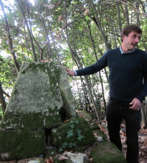 Adrien with one of the hitoric discoveries on the property, a pyramid with Latin and Spanish phrases noting 