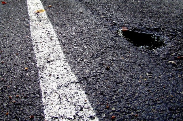 The road goes on forever — will the potholes never end? (photo: Flickr user articnomad)