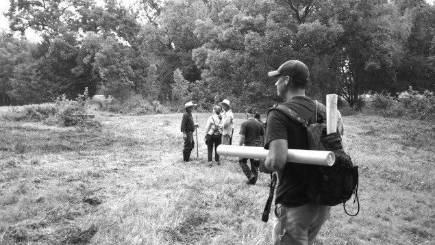 Ben Sandifer (in foreground) hikes through the Trinity Forest. Photo by Laray Polk