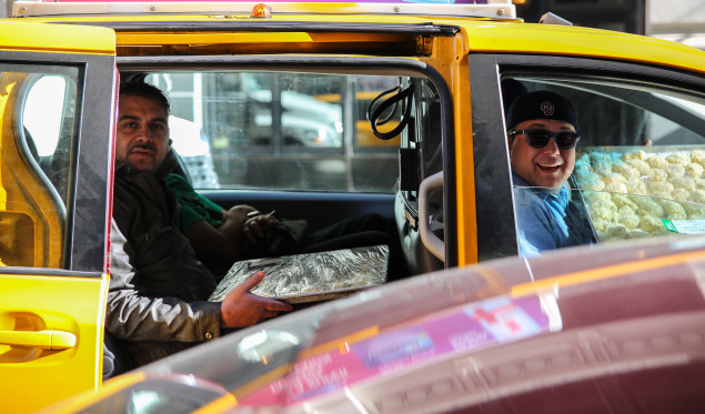 Brian Knoy and the Nick & Sam's team transporting food from the prep kitchen to the James Beard House via cab in Manhattan. 
