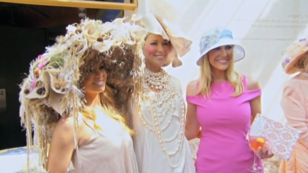 Brandi, LeeAnne, and Stephanie wear hats in the Charity World.