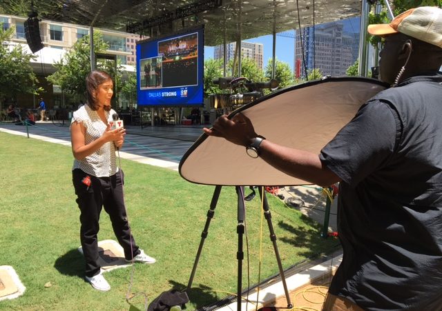 This poor Telemundo reporter. Not only did she have to endure the direct sunlight, but a dude was reflecting even MORE heat on her.