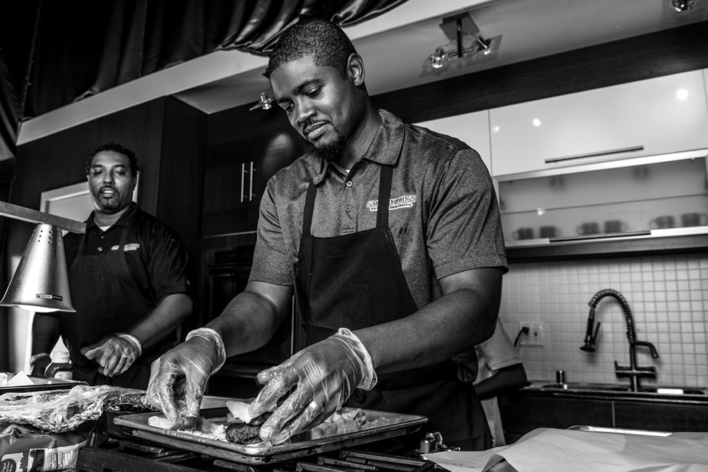 Brent Reaves prepares the Deep Fried Bacon Burger Slider Dog on a Stick, the brothers’ other entry in the contest.