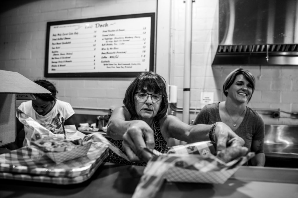 Christi Erpillo plates her Down Home Chicken Pot Pie Pocket (with mac-and-cheese dip), adjusting the liner paper until it’s just right. Erpillo’s family is known for being the first to bring funnel cake to the State Fair, in the 1980s.