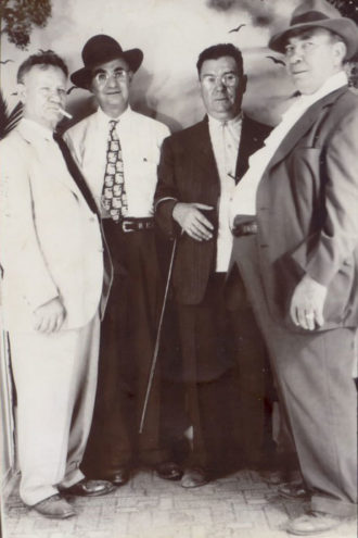 Papa Carlo Campisi (right) mingles with relatives (from left) Joe Cammarata, Joe Miller, and Charles Angelo.