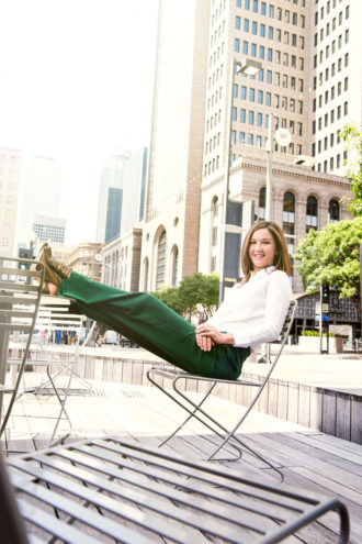 Kourtny Garrett leans back in downtown, which she hopes to make even more livable than it is.
