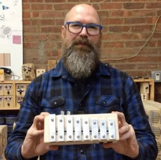 Richard Upchurch with the new Phone-Home xylophone, now made in Dallas.