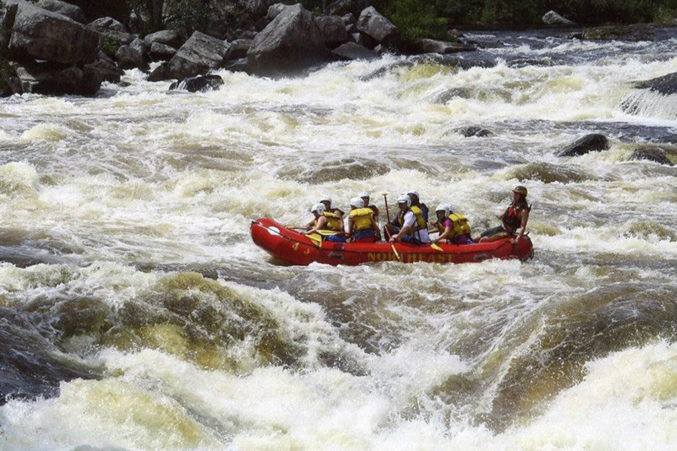 Debra von Storch white-water rafts with her family in Maine. Top right: von Storch with her son and husband on a hike in Peru.