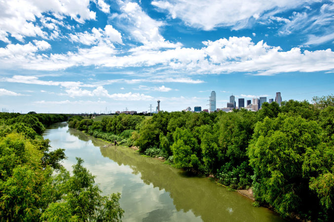 The Trinity River, with downtown Dallas peeking through the trees. (Credit: Justin Terveen) 