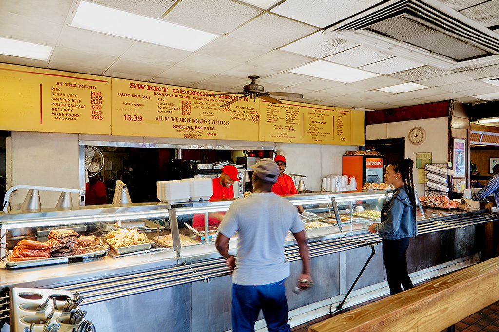 WALK THE LINE: South Dallas residents head to Sweet Georgia Brown to get their soul food fix of collard greens and smothered pork chops.