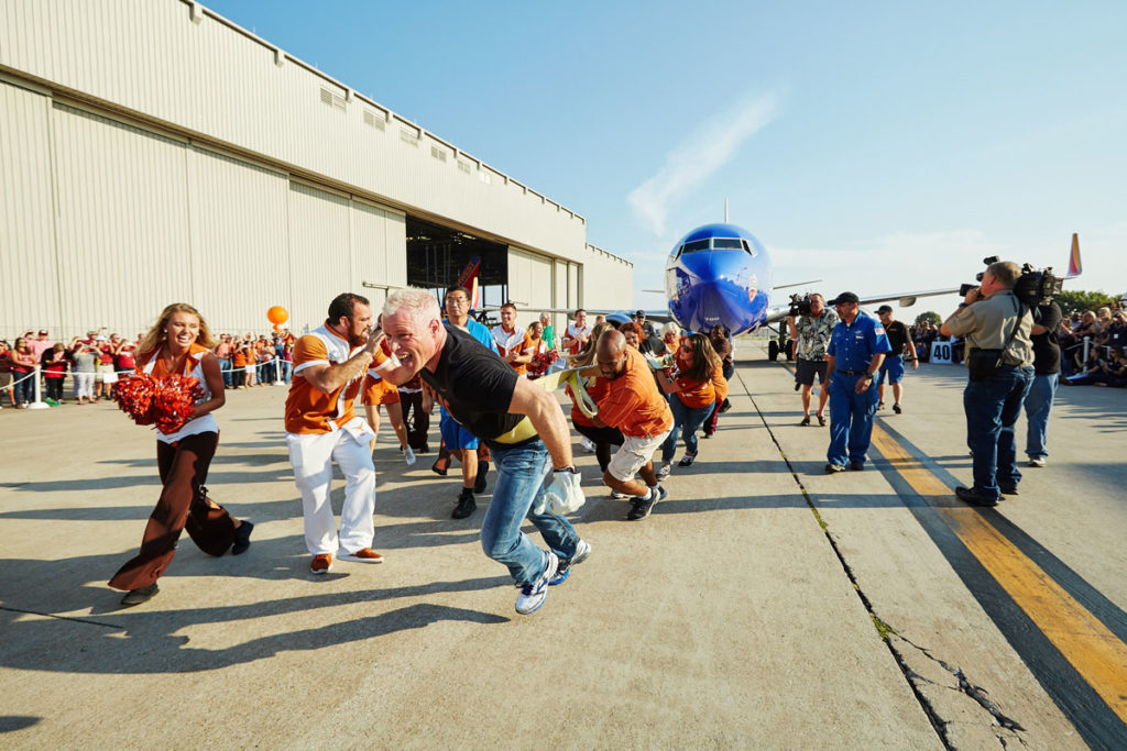 Employees had fun at the Southwest Airlines Pigskin Plane Pull, which celebrated the 2015 Texas-OU football game. Image courtesy of Southwest Airlines.