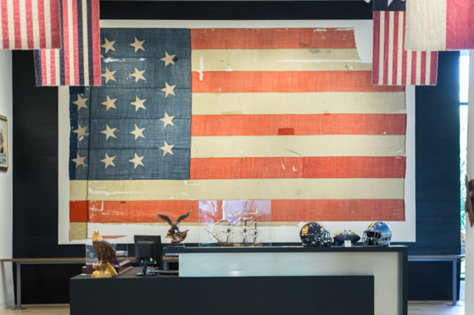A flag from the original U.S.S. Constitution hangs at the new Perot Co. headquarters in Turtle Creek. (Photo: Jessica Chen)