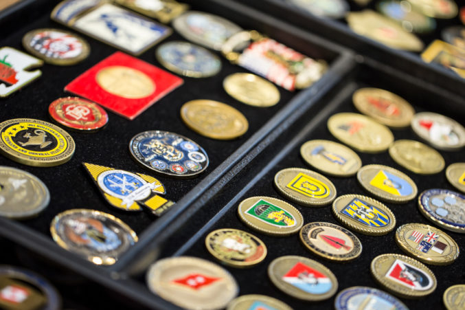 Rows and rows of these coins line the outside of Ross Perot Sr.'s office, so many that you may be inclined to wonder if he is running out of room. (Photo: Jessica Chen)