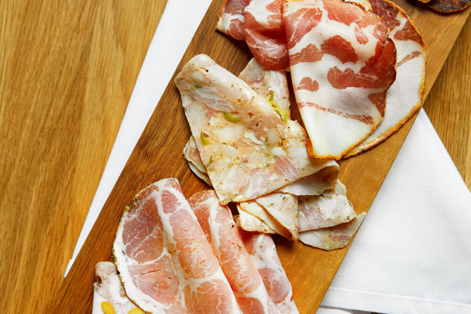 A charcuterie board of cured meats from Macellaio.