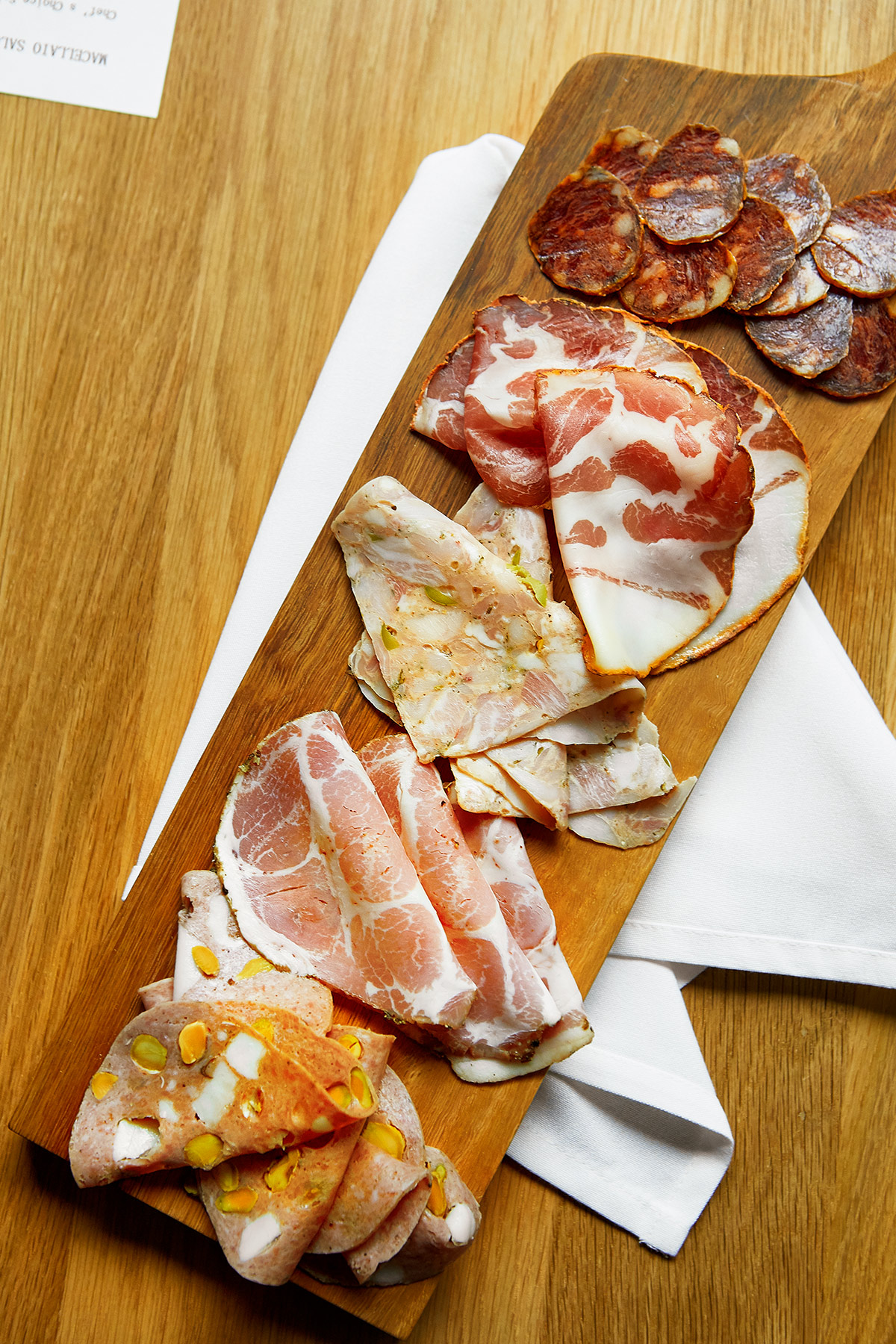 A charcuterie board of cured meats from Macellaio.