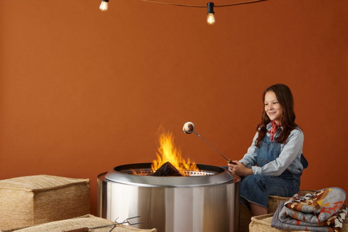 Little Girl Making S'mores by Fire Pit