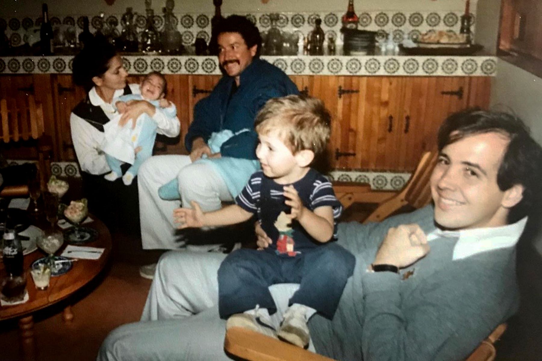 Carlos F. Aguilar with his son and family