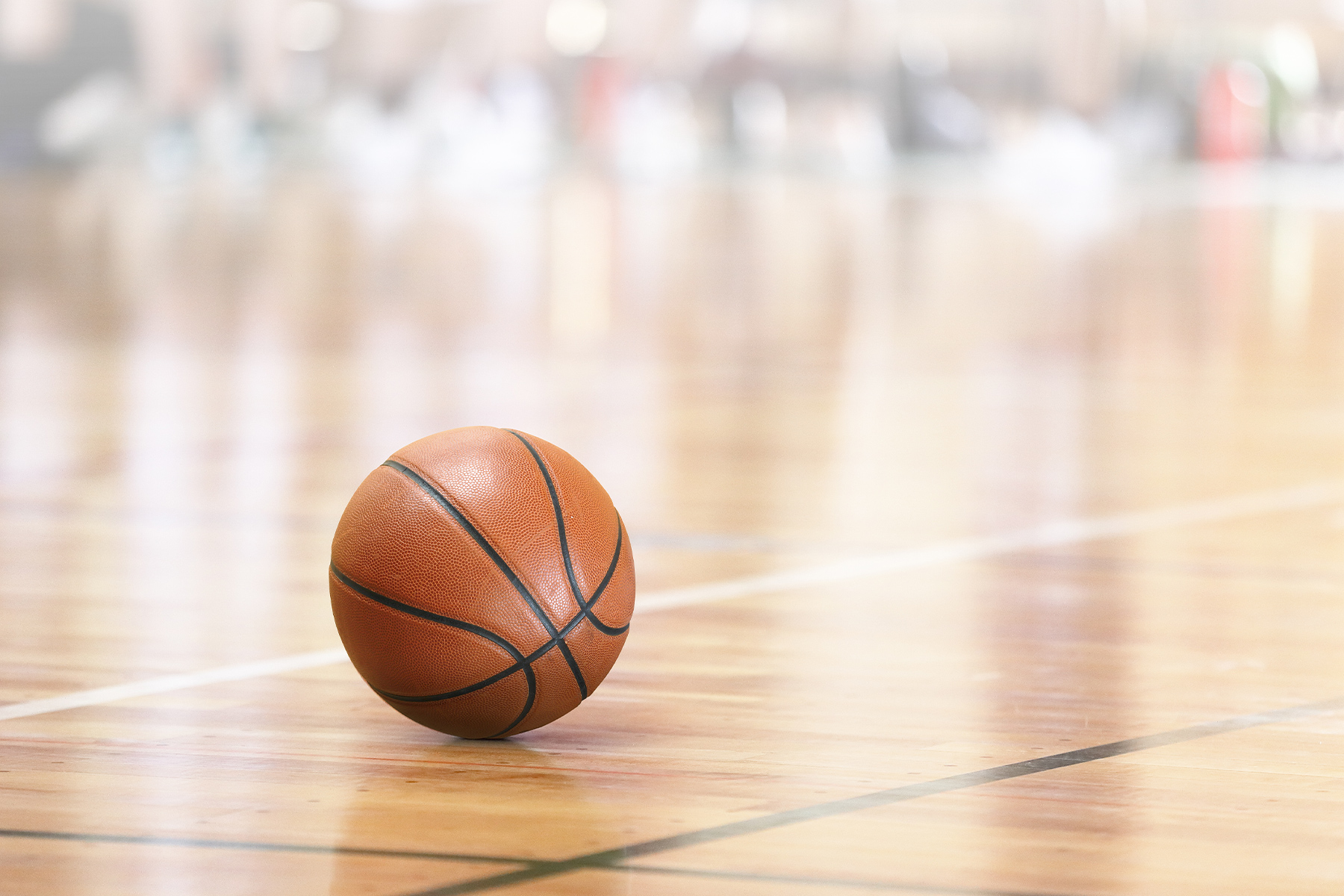 Basketball on Court Floor