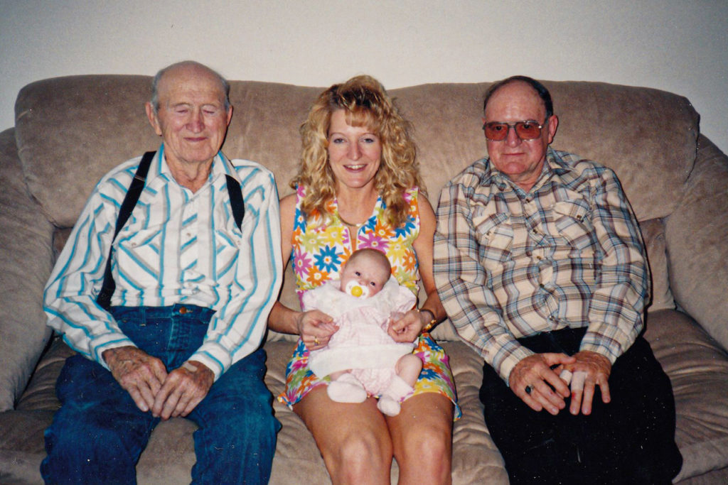 Harold sitting next to his daughter, Deb, and his granddaughter.