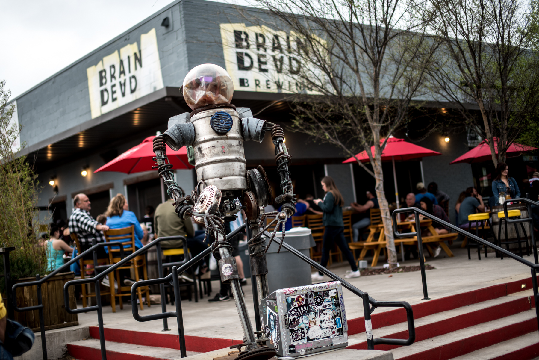 the exterior of BrainDead Brewing in Deep Ellum with an elevated patio.
