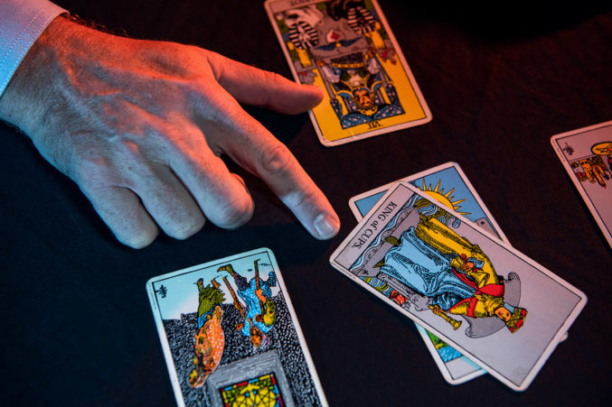 David Coale partner at Lynn Pinker Cox & Hurst reading tarot cards