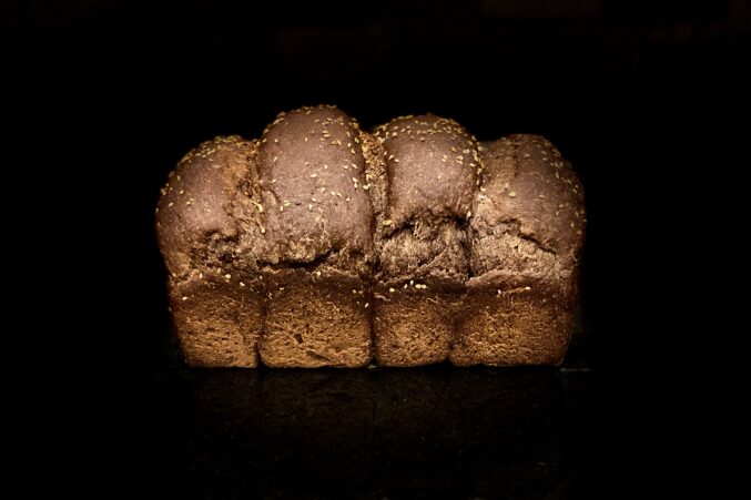 A loaf of brown, rye bread.