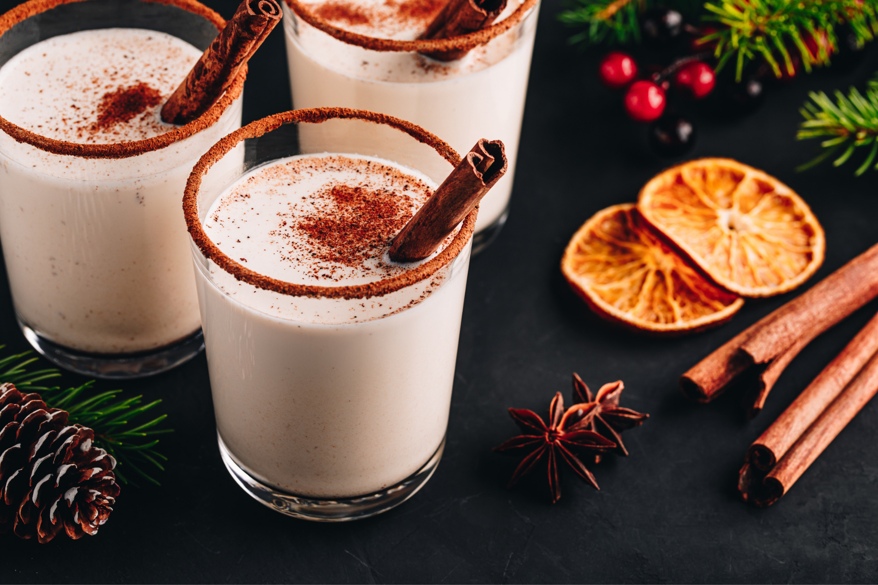 Three glasses of coquito, a tropical eggnog sans eggs, made with rum