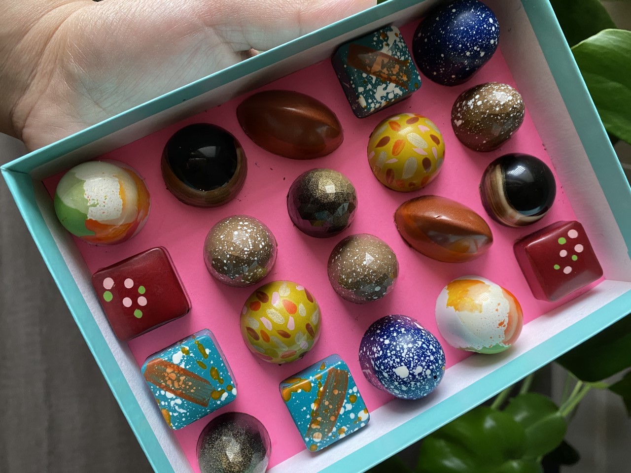 A box of colorful chocolate bonbons by Maravilla Cacao.