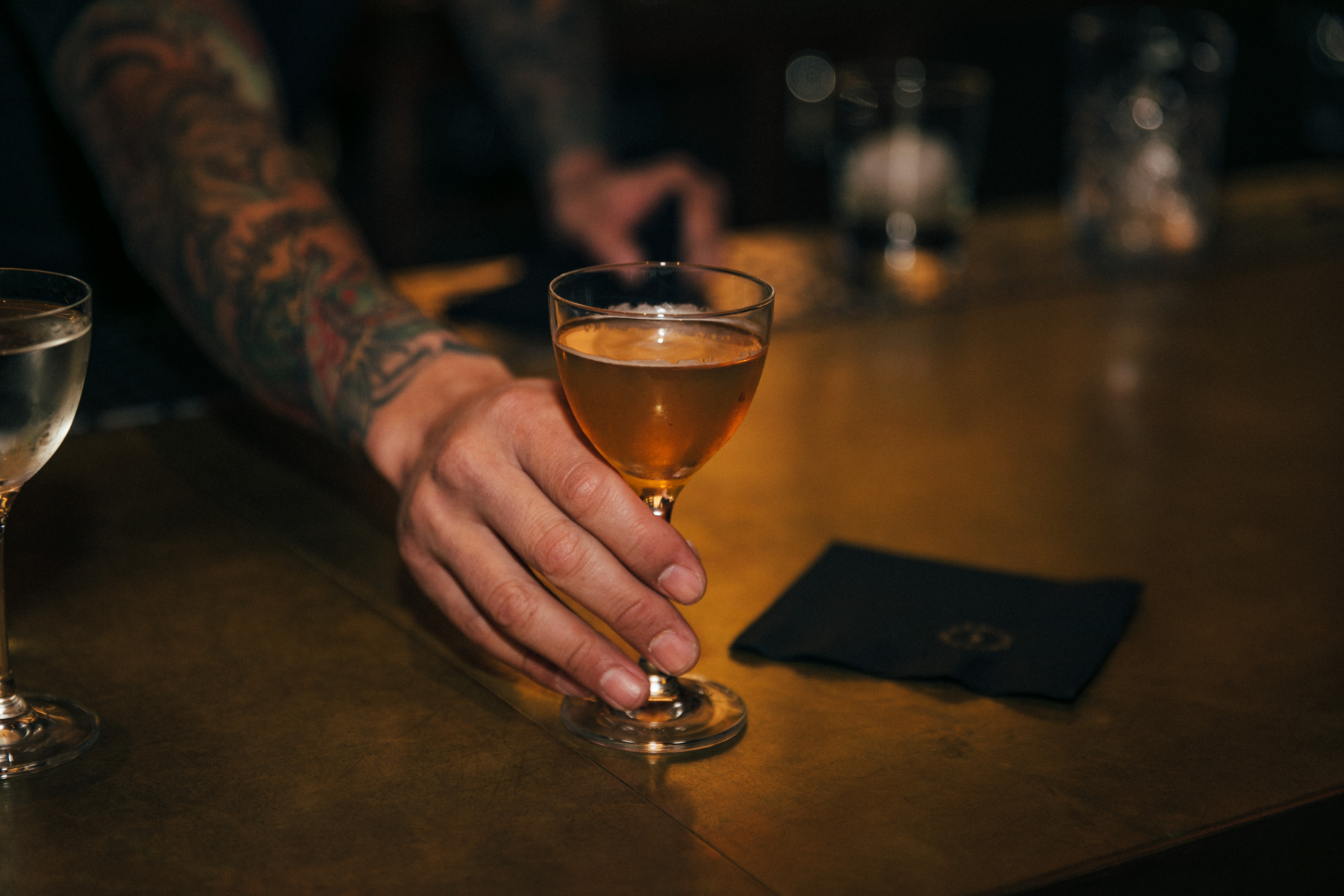 A cocktail on a bar top.