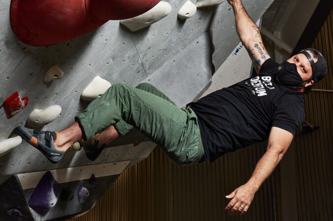Chad Houser of Cafe Momentum rock climbing