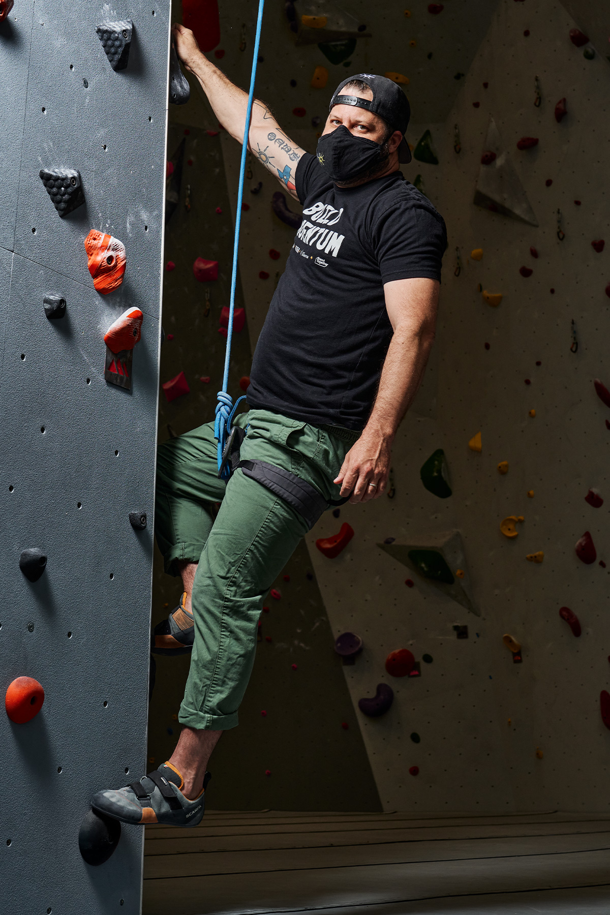 Chad Houser of Cafe Momentum rock climbing