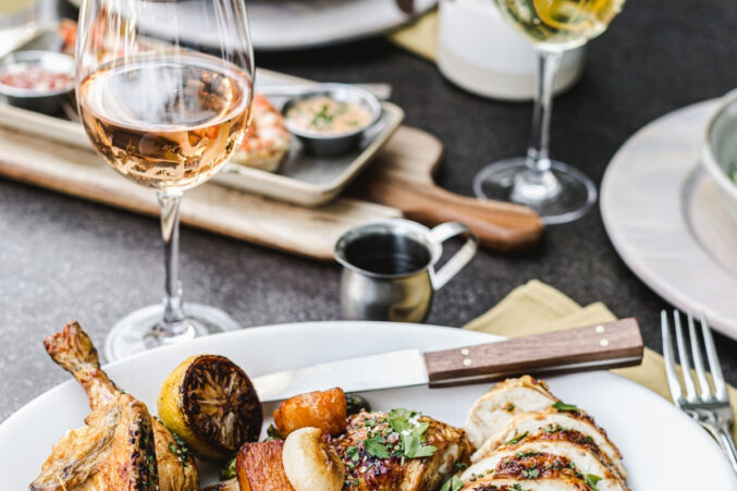 Plate of roast chicken with wine from The Henry