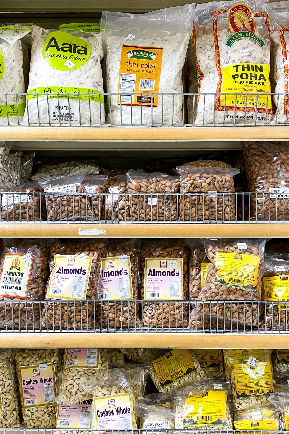 A grocery aisle with shelves of whole nuts