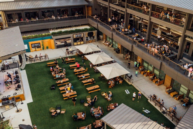 An outdoor space with a stage at Plano's Legacy Hall