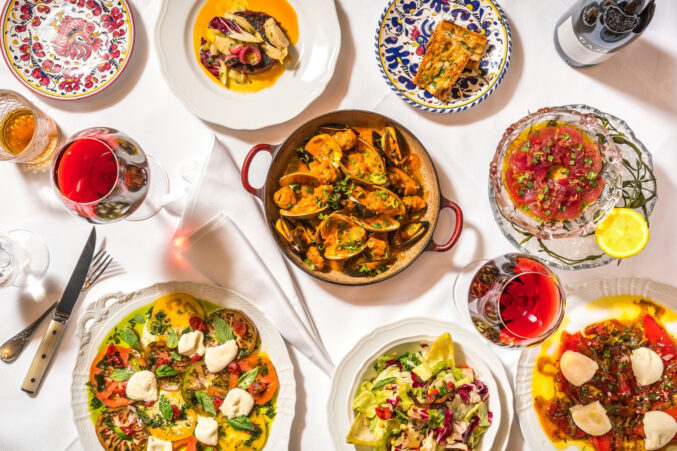 A table spread of Italian dishes.