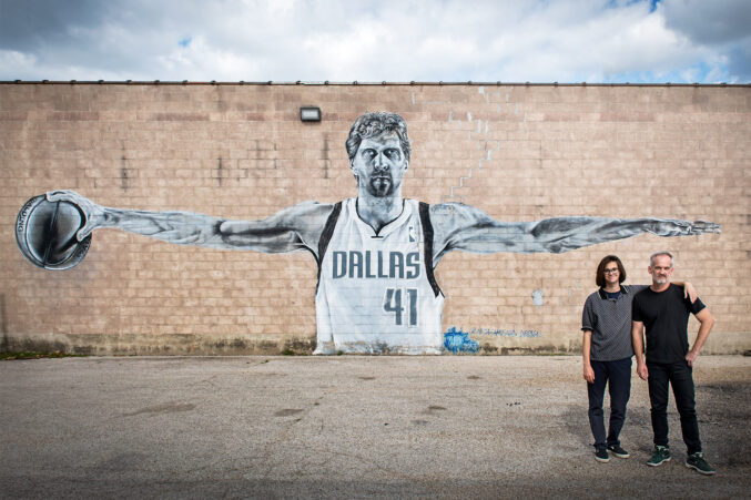 Zac Crain with son in front of Dirk mural